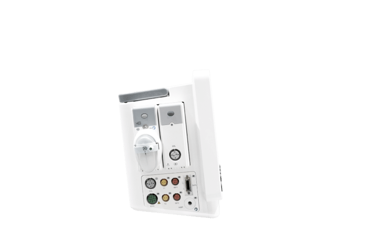 Vue du côté du moniteur vétérinaire G12 Vet : deux modules blancs et gris insérés côte à côte, dont celui de gauche avec un réservoir blanc à sangle et un raccord vert, et celui de droite avec un connecteur rond marqué CO2 ; en dessous, un panneau de connecteurs étiquetés CO2, ECG, T1, T2, IBP1, IBP2, SpO2 et NIBP ; une poignée grise est visible en haut.